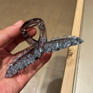 Elegant large crystal hair claw clip with blue rhinestones and purple resin base