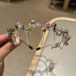 Detailed view of bohemian style crystal beaded headband with non-slip plastic teeth