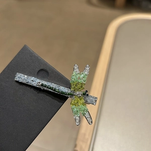 Elegant crystal dragonfly hair clip with green rhinestones and silver metal finish