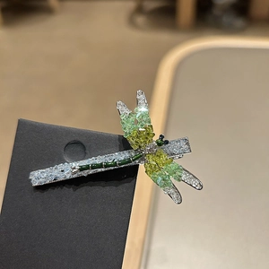 Elegant crystal dragonfly hair clip with green rhinestones and silver metal finish