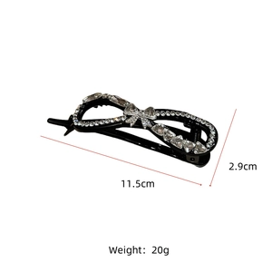 Detail view of large black banana clip with rhinestones, size 11.5cm by 2.9cm and 20g weight