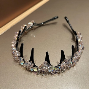 Detail view of champagne crystal beads on a non-slip black headband with teeth comb