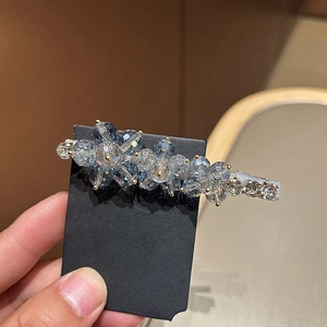 Blue crystal floral hair clip with three flowers on metal base for elegant hair styling