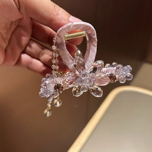 Elegant crystal shark clip with pink fabric wrap and cascading pearl tassel for hair