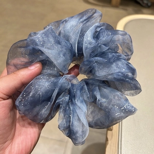 Elegant blue organza scrunchie with shimmering silver glitter and large ruffled design