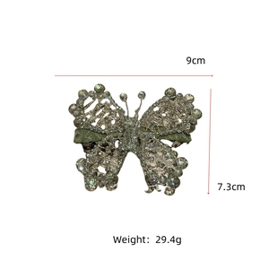 Detail showing crystal-beaded butterfly hair clip dimensions at 9cm width and 7.3cm height