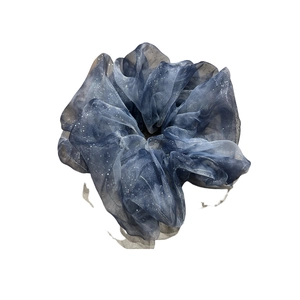 Sparkling dark blue organza scrunchie with silver sequins and star-patterned texture