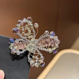 Handmade crystal butterfly hair clip with iridescent beads and pink ribbon base