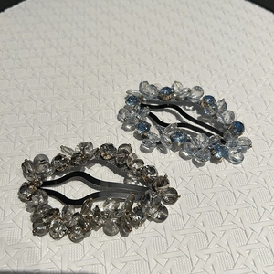 Detailed view of handmade crystal bead hair clips with sparkling oval cloud design