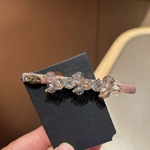 Elegant Korean style handmade hair clip featuring champagne crystal beads and pink satin base