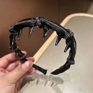 Close-up of black silk headband with sparkling rhinestones and inner non-slip hair teeth