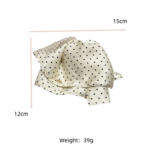 Polka dot satin hair claw clip dimensions 15cm x 12cm with gold metal detail