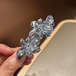 Elegant light blue rhinestone hair clip featuring double 3D floral design and gold metal tag