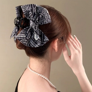 Elegant large bow hair claw clip with black and white vintage paisley print for women