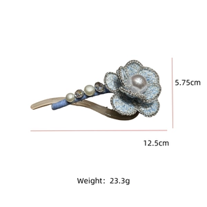 Blue tweed camellia hair clip with large faux pearl and sparkling rhinestone details