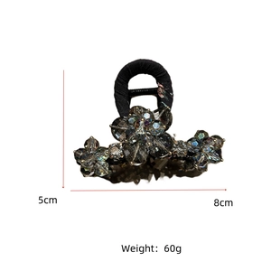 Detail view of 8cm gray crystal flower hair claw showing size and weight specs