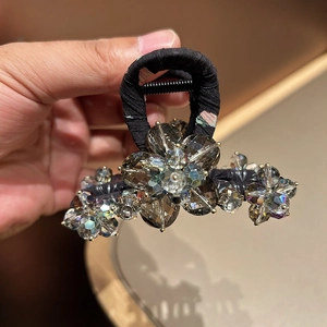Elegant floral hair claw clip with black fabric and grey crystal embellishments