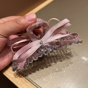 Pink ribbon bow hair claw clip with crystal beads and rhinestones for elegant styling