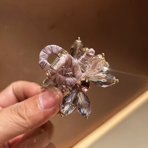 Elegant floral hair claw clip with pink crystals and high-crown padded headband aesthetic