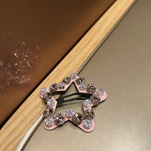 Detailed view of cloud-shaped pink star hair clip with glittering rhinestones