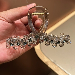 Detail showing crystal beads and acrylic base of this luxury hair claw clip for women