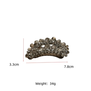 Macro detail of curved hair clip with faceted smoky grey beads and dimensions 7.8cm by 3.3cm