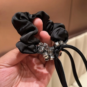 Elegant black satin scrunchies with sparkling square crystals and hanging straps