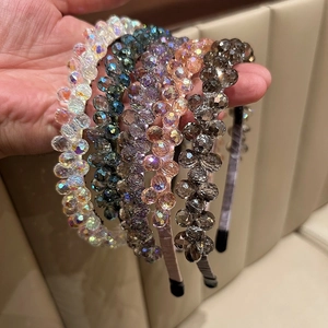 Macro detail of luxury crystal beaded headbands in multiple shimmering colors and textures