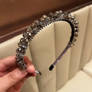 Macro view of grey faceted crystal beads and non-slip hairband teeth details