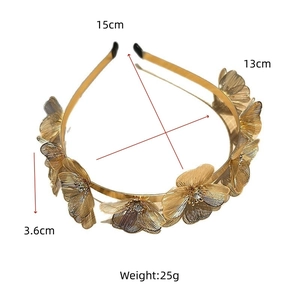 Detailed view of golden metal flower headband with rhinestones showing 15cm dimensions