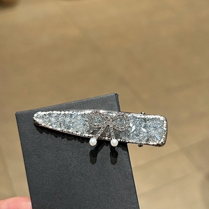 Blue sparkling crystal duckbill hair clip with silver bow and pearl accents for women