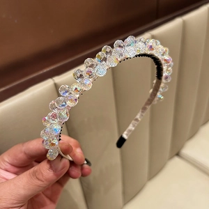 Close-up of luxury crystal headband with colorful light refraction and non-slip inner teeth