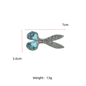Macro view of blue rhinestone heart hair clip showing detailed size of 7cm x 3.6cm