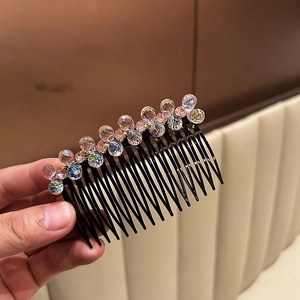 Detail view of stylish crystal hair side comb with sparkling multi-colored beads