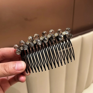 Detailed view of luxury crystal hair comb with grey faceted beads and sparkling rhinestones