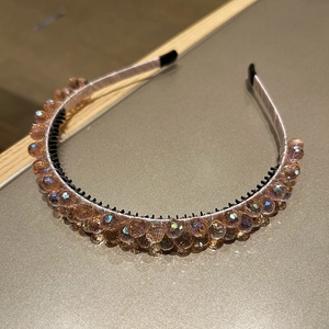 Detailed macro view of champagne pink beaded headband with inner non-slip teeth grip