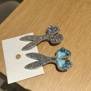Chic scissor shaped hair clips with blue and pink crystal rhinestones on display card