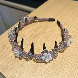 Detail of beaded headband with lily flowers, crystals, and anti-slip hair comb teeth