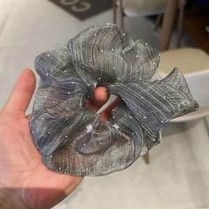 Sparkling grey seersucker scrunchie with striped glitter texture and French retro design