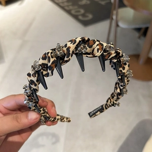 Leopard print headband with black spikes and crystals for women's hair styling