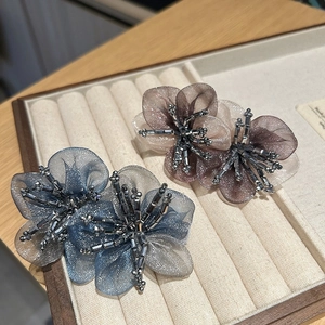 Elegant organza flower hair clips with crystal bead centers in grey and pink shades