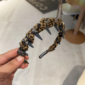 Leopard print headband with black spikes and crystals for high cranial top hairstyle