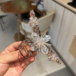Elegant champagne crystal flower hair claw clip with handcrafted rhinestones for women