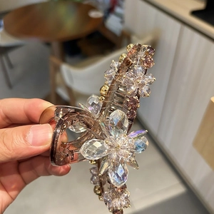 Elegant floral crystal hair claw clip with hand-woven rhinestones in light coffee resin