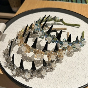 Detail view of crystal beaded headbands with anti-slip teeth in champagne and blue colors