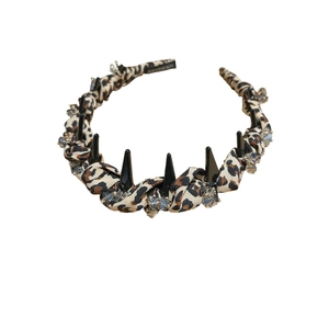 Punk leopard print headband with black resin spikes and crystal rhinestones