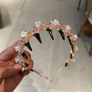 Close-up of pink crystal beaded headband with non-slip black inner teeth detail
