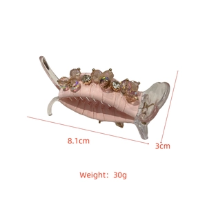 Detailed view of pink crystal hair claw clip with dimensions 8.1cm by 3cm and 30g weight