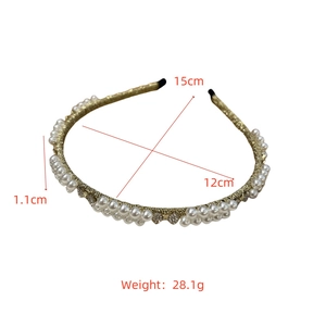 Detailed view of Baroque gold pearl headband with 1.1cm width and 28.1g weight specs