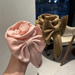 Chic floral headband with fabric rose and large bow design in pink and brown